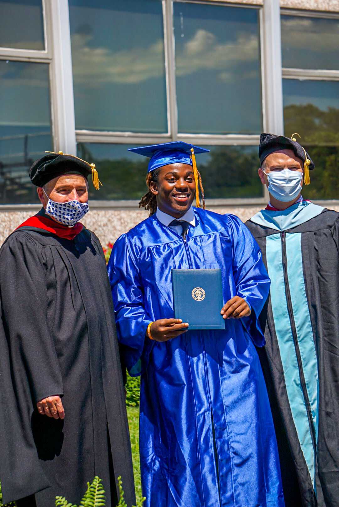 Holy Spirit drive-through diploma pickup